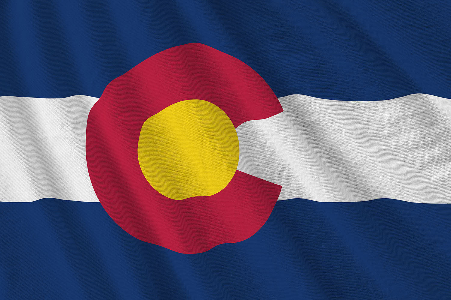 Colorado state flag featuring a red C on a white stripe against a dark blue field