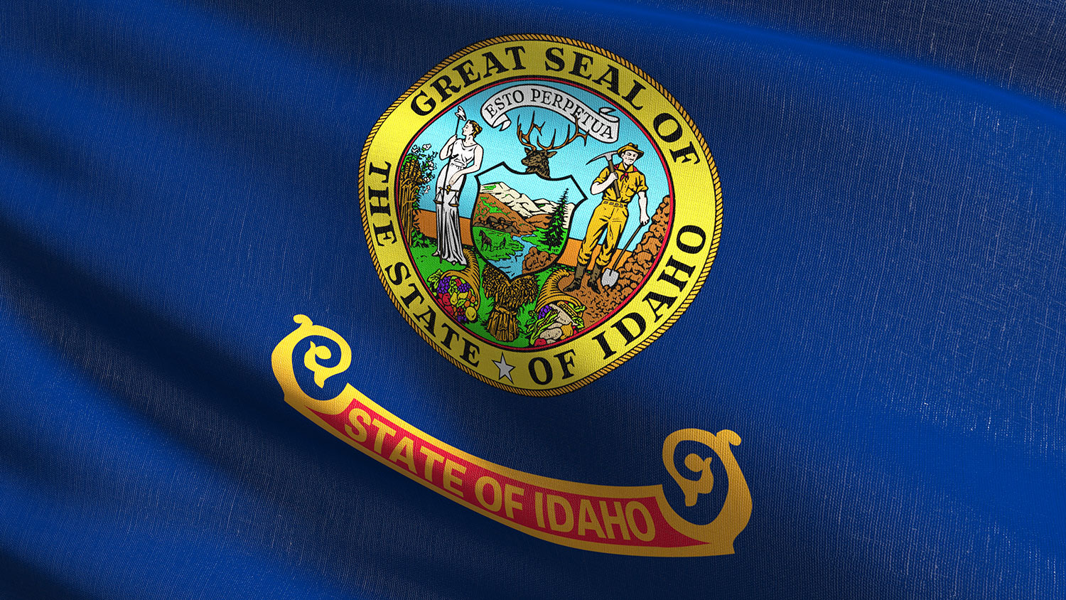 Close up of the Idaho state flag featuring the state seal on a dark blue field